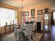 Dining room with modern chandelier, decorative wall art, and comfortable seating for elegant meals at 13626 Garfield St # A, Thornton, CO 80602