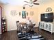 Cozy dining area features a dark wood table, decorative lighting, and attractive decor at 13626 Garfield St # A, Thornton, CO 80602