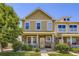 Charming two-story home featuring stone accents, a welcoming porch, and manicured landscaping at 13626 Garfield St # A, Thornton, CO 80602