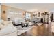Bright living room with elegant decor and hardwood floors flowing into the dining area at 13626 Garfield St # A, Thornton, CO 80602
