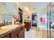 Spacious main bathroom featuring a soaking tub, walk-in shower, and dual vanities at 13626 Garfield St # A, Thornton, CO 80602