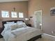Cozy main bedroom featuring a king bed, ample natural light, and en-suite bathroom at 13626 Garfield St # A, Thornton, CO 80602