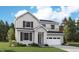 Charming two-story home showcasing a modern farmhouse exterior with vertical siding and a well-manicured lawn at 2656 Sawyer Ln, Erie, CO 80026