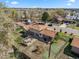 Aerial view of the property showcasing its spacious backyard, deck, and well-maintained landscaping in a peaceful setting at 2009 S Zephyr Ct, Lakewood, CO 80227