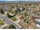 Property aerial view with views of neighborhood, mountains, front and back yards, plus nearby amenities at 2009 S Zephyr Ct, Lakewood, CO 80227