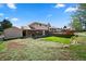 Large backyard featuring a spacious deck, storage shed, and plenty of room for outdoor recreation and relaxation at 2009 S Zephyr Ct, Lakewood, CO 80227