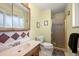 Bathroom features a marble sink, oak cabinet and a walk-in shower with glass door at 2009 S Zephyr Ct, Lakewood, CO 80227