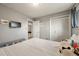 Bedroom with laminate floors, natural light, ample storage, and easy access to the bathroom at 2009 S Zephyr Ct, Lakewood, CO 80227