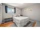 Cozy bedroom features a comfortable bed, soft rug, and ample natural light at 2009 S Zephyr Ct, Lakewood, CO 80227