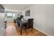 Charming dining area with hardwood floors, a classic table, and access to the living room at 2009 S Zephyr Ct, Lakewood, CO 80227