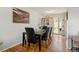 Elegant dining room featuring hardwood floors, stylish furniture, and a view of the backyard at 2009 S Zephyr Ct, Lakewood, CO 80227