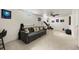 Finished basement living room with neutral carpet, ceiling fan and plenty of natural light at 2009 S Zephyr Ct, Lakewood, CO 80227