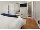 Bright main bedroom with hardwood floors, walk-in closet, and access to the Primary bathroom at 2009 S Zephyr Ct, Lakewood, CO 80227