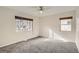 Bright bedroom with gray carpeting and large windows at 4981 E Cornell Ave, Denver, CO 80222