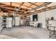 Spacious garage with workshop area and ample storage shelving at 4981 E Cornell Ave, Denver, CO 80222