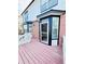 Exterior view of backyard from deck featuring screened door to house at 26032 E Geddes Cir, Aurora, CO 80016