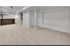 Large finished basement featuring neutral carpet and a stylish bar area with recessed lighting at 26032 E Geddes Cir, Aurora, CO 80016