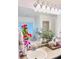 Bright bathroom with a large mirror, vanity counter decorated with flowers and plants at 26032 E Geddes Cir, Aurora, CO 80016