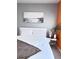 Bright bedroom featuring gray and orange walls, a modern bed frame, and stylish decorative accents at 26032 E Geddes Cir, Aurora, CO 80016