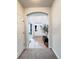 Bright foyer with an arched entryway, neutral walls, tile floors and stylish décor at 26032 E Geddes Cir, Aurora, CO 80016