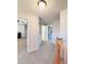 Second floor hallway with neutral carpeting and interior doors at 26032 E Geddes Cir, Aurora, CO 80016