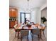 Bright kitchen area featuring a dining table set for four and a view outdoors at 26032 E Geddes Cir, Aurora, CO 80016