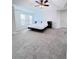 Well-lit main bedroom with neutral carpet, ceiling fan, and large window at 26032 E Geddes Cir, Aurora, CO 80016