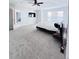 Bright main bedroom featuring a ceiling fan and a large window at 26032 E Geddes Cir, Aurora, CO 80016