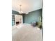 Inviting home office featuring a decorative light fixture, and a peaceful green wall at 26032 E Geddes Cir, Aurora, CO 80016