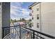 A balcony view showcases urban scenery, the building exterior, and a glimpse of the neighborhood at 3500 S Corona St # 407, Englewood, CO 80113