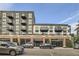 Street view of the building exterior, highlighting the architecture and garage entrances at 3500 S Corona St # 407, Englewood, CO 80113