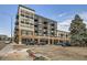 Exterior of the modern building with balconies and garage entrances at 3500 S Corona St # 407, Englewood, CO 80113