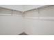 Empty walk-in closet with white walls and neutral carpet and shelving for maximum space for storage and customization at 3500 S Corona St # 407, Englewood, CO 80113