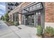 Building entrance featuring double doors, brick accents, and a covered awning at 3500 S Corona St # 407, Englewood, CO 80113