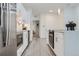 Modern kitchen featuring an island, stainless steel appliances, and white cabinets at 3500 S Corona St # 407, Englewood, CO 80113