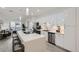 Open concept kitchen with stainless steel appliances, sleek cabinets, and an island with stool seating at 3500 S Corona St # 407, Englewood, CO 80113