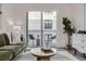 Comfortable living room with an exit to the balcony at 3500 S Corona St # 407, Englewood, CO 80113