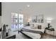 Cozy bedroom with a large window, stylish decor, and a comfortable bed at 3500 S Corona St # 407, Englewood, CO 80113