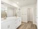 This bathroom features a double sink and multiple entry doors at 1937 S Coolidge Way, Aurora, CO 80018