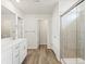 This bathroom features a double sink and a glass shower at 1937 S Coolidge Way, Aurora, CO 80018