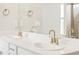 Bathroom with a dual sink vanity, quartz countertop and brushed gold fixtures at 1937 S Coolidge Way, Aurora, CO 80018