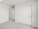 This bedroom features neutral walls and carpet and a large closet with sliding doors at 1937 S Coolidge Way, Aurora, CO 80018