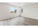 Spacious bedroom with hardwood floors, lots of natural light from large windows, and an inviting atmosphere at 1937 S Coolidge Way, Aurora, CO 80018