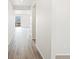 Bright hallway with hardwood floors leading to an airy living space, perfect for welcoming guests into your new home at 1937 S Coolidge Way, Aurora, CO 80018