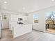 Modern kitchen with white cabinets, stainless steel appliances, a center island, and hardwood floors, great for cooking at 1937 S Coolidge Way, Aurora, CO 80018
