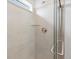 Modern shower with glass door, tiled walls, and brushed steel shower head at 1937 S Coolidge Way, Aurora, CO 80018