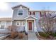 Charming home featuring a covered entrance and red shutters that add character and curb appeal at 5830 Ceylon St # B, Denver, CO 80249