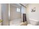 Cozy bathroom features a shower with glass sliding doors and a large soaking tub at 7700 W Grant Ranch Blvd # 4A, Littleton, CO 80123