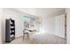 Bright bedroom features plush gray carpet, a desk and a large closet at 7700 W Grant Ranch Blvd # 4A, Littleton, CO 80123