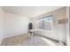 Bedroom features plush gray carpet, a desk and a large bright window at 7700 W Grant Ranch Blvd # 4A, Littleton, CO 80123